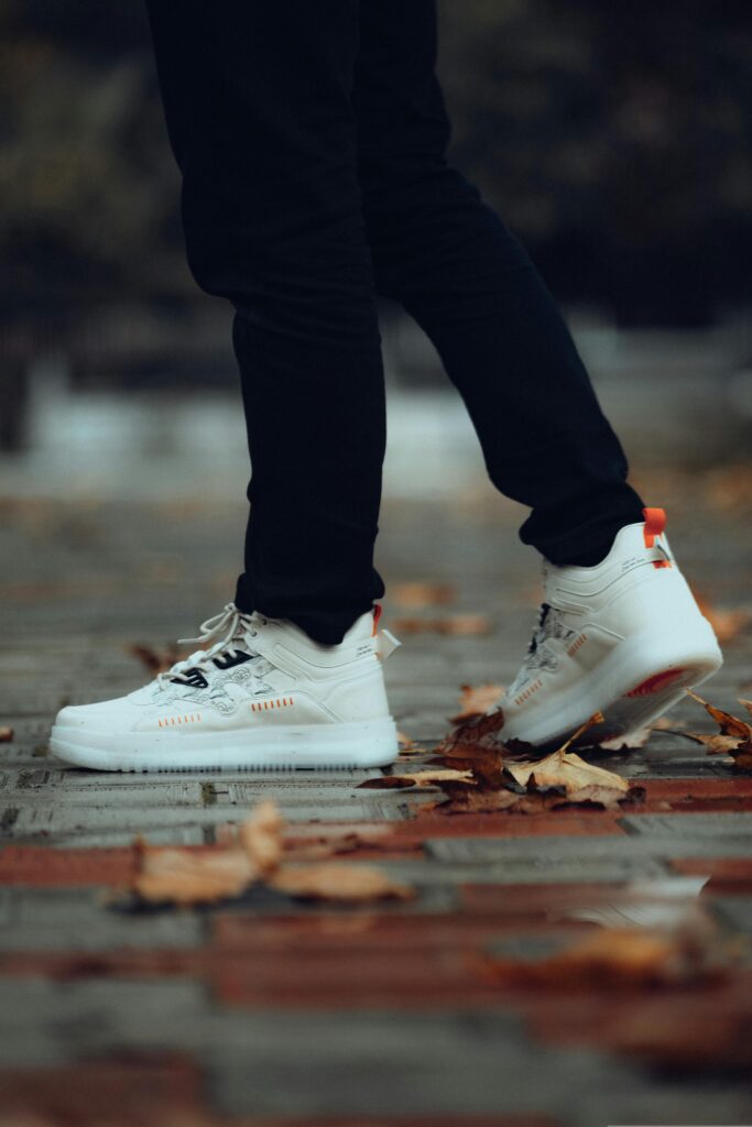 White sneakers paired with midi dress and oversized blazer for street style
