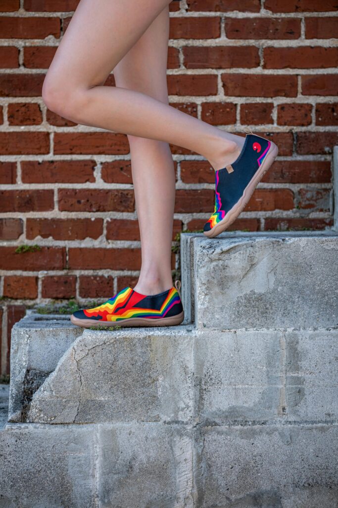 Colorful shoes on a concrete step.
