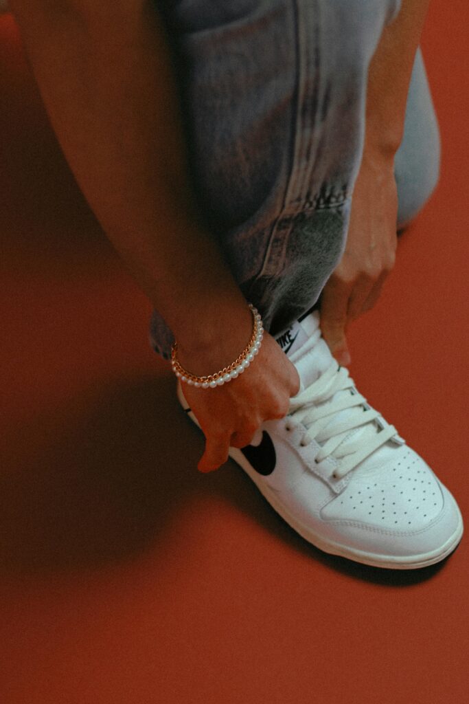 Men styling high tops with slim jeans and bomber jacket